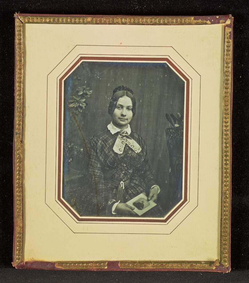 [Portrait of a Woman Holding a Daguerreotype Portrait of a Man]