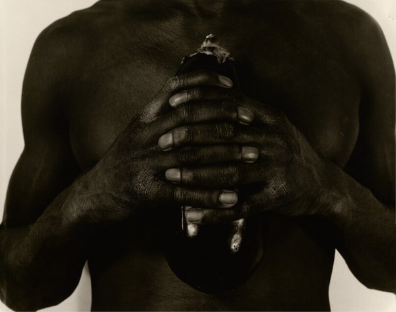 [Man holding eggplant]