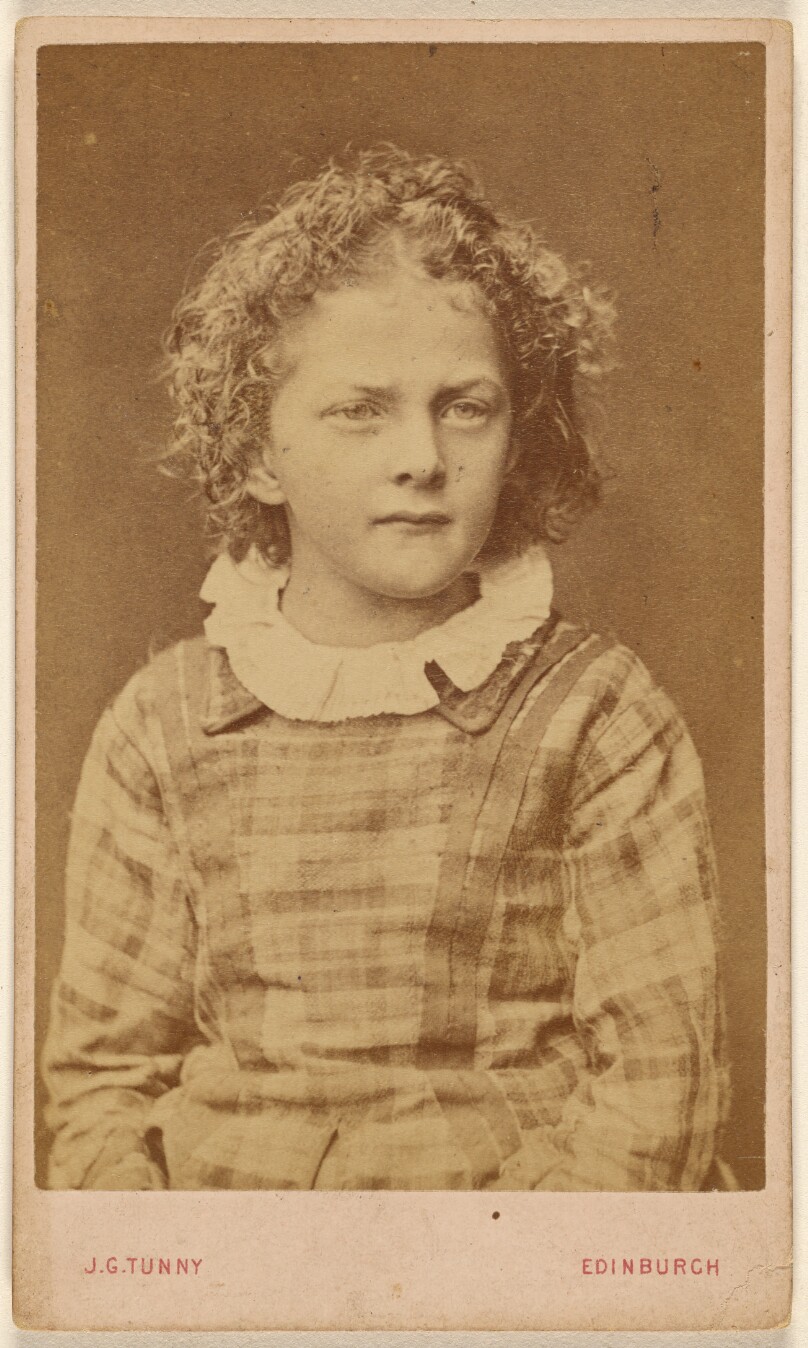 [Unidentified little girl, seated]