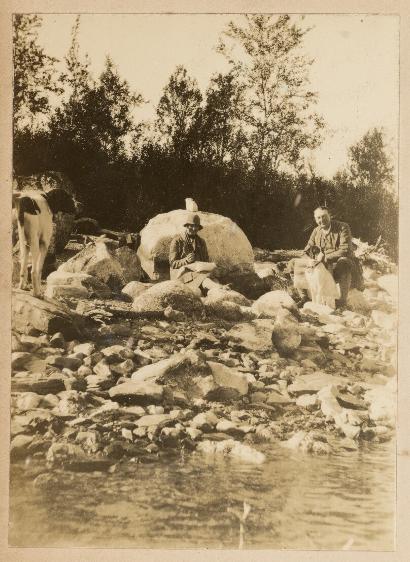[Two men with dogs]