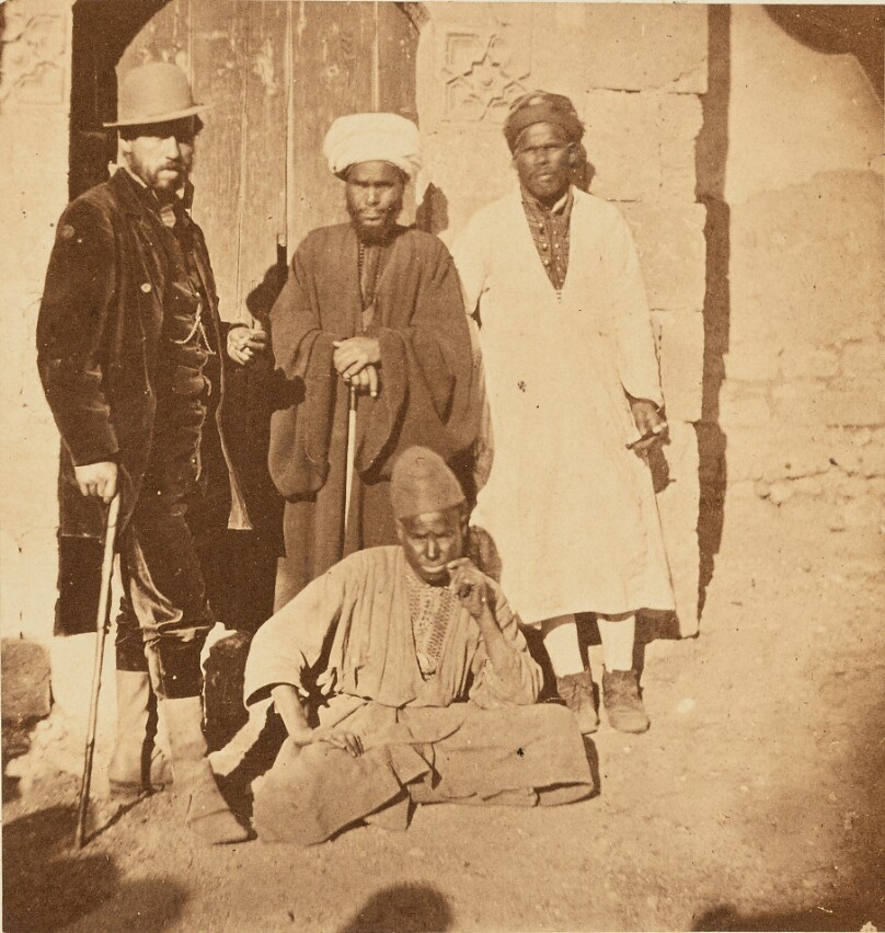[Group portrait of four men]
