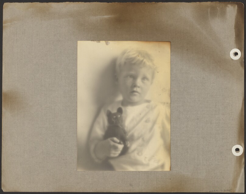 [Brett Weston holding black rubber cat]