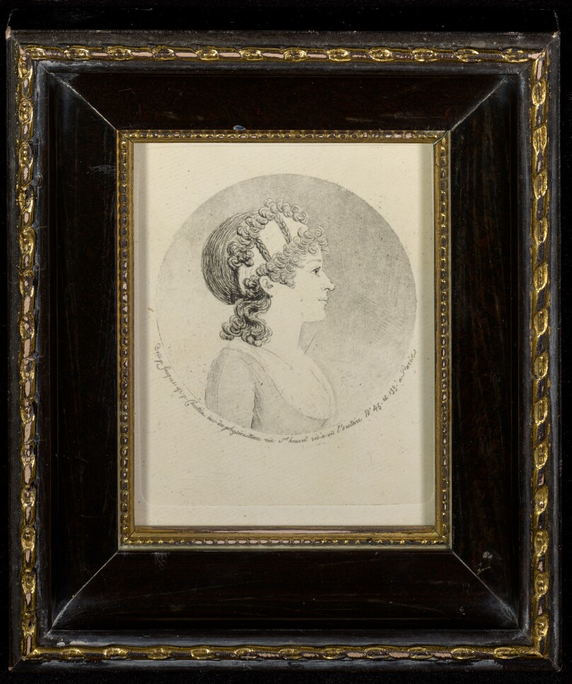 [Profile portrait of a woman]