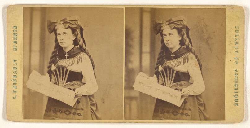 [Young woman standing, holding a "La Republique Francaise" newspaper]