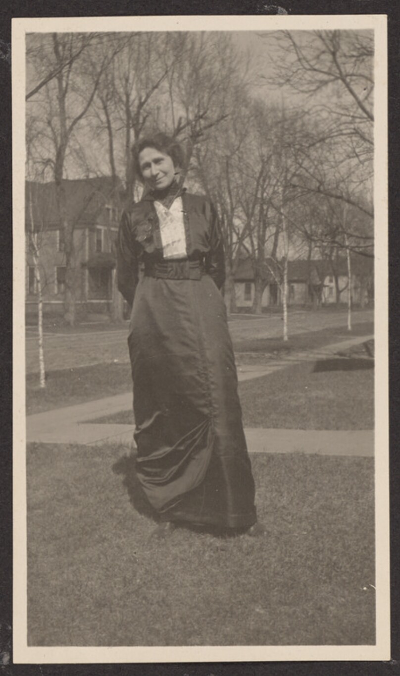 [Woman posing on a lawn]