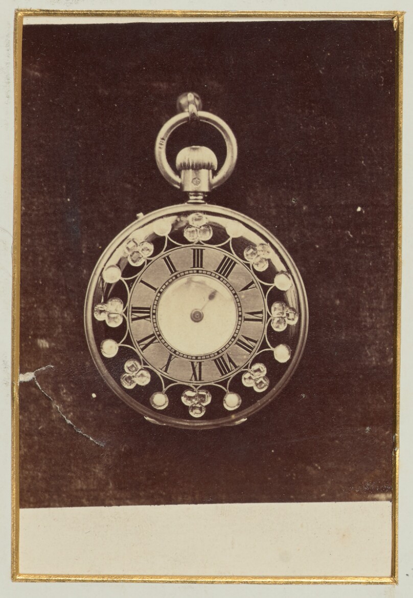 [Ornate pocket watch]