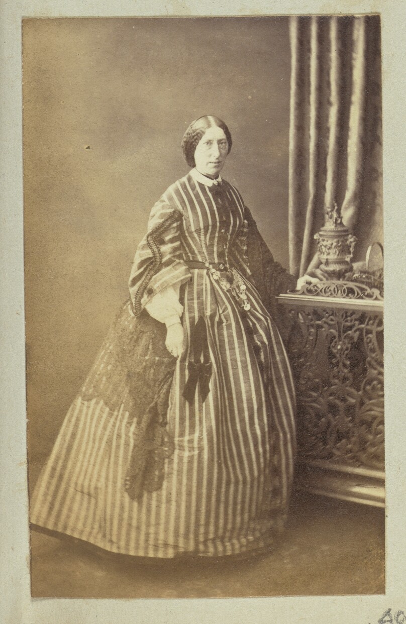 [Portrait of woman in striped dress]
