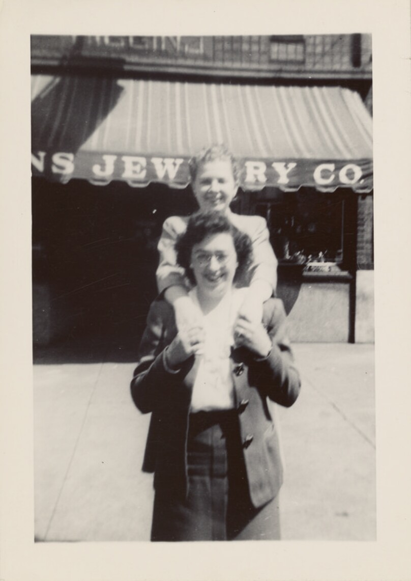 [Two women in front of jewelry store]