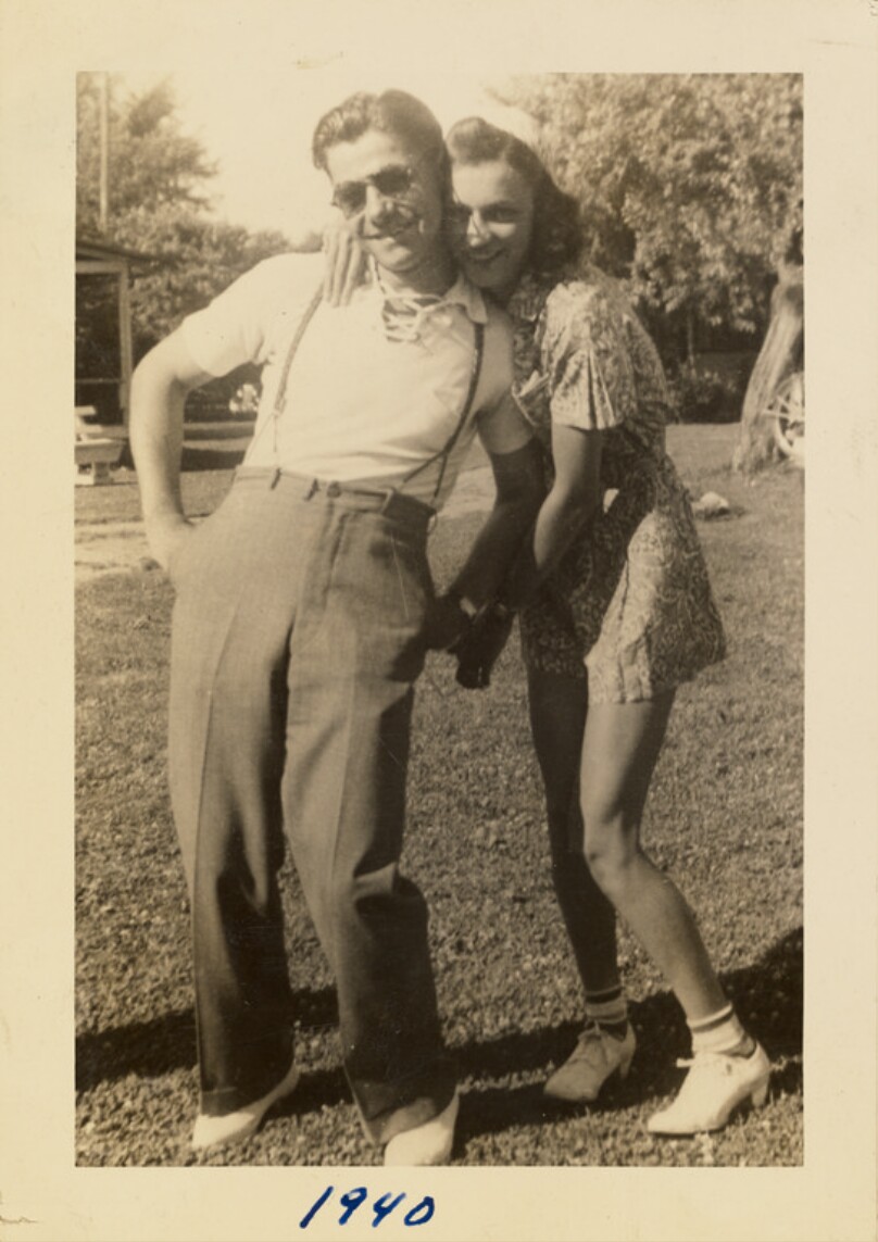 [Man and woman posing together]