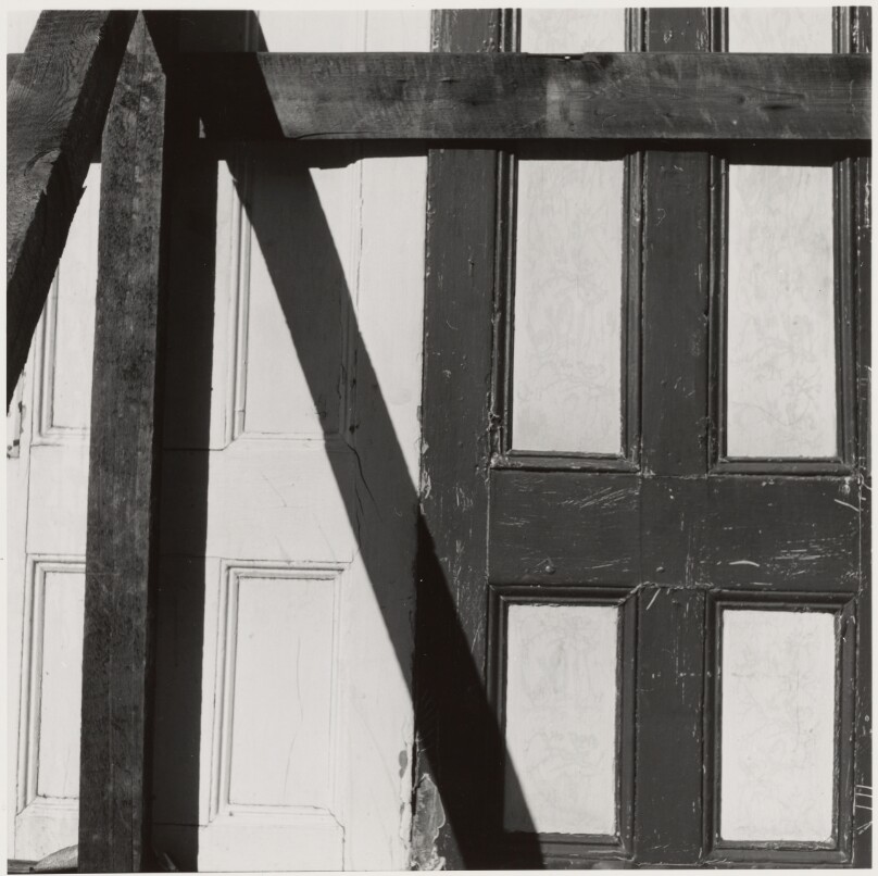 [Doors Nailed Shut with Boards]