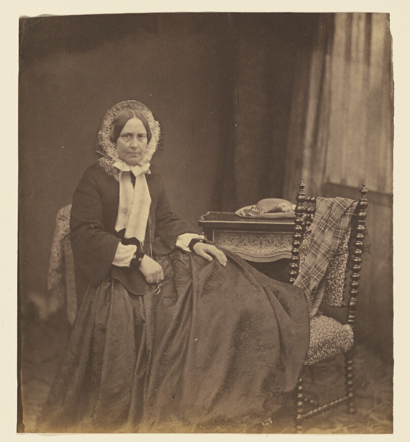 [Portrait of a woman, wearing a bonnet, seated]
