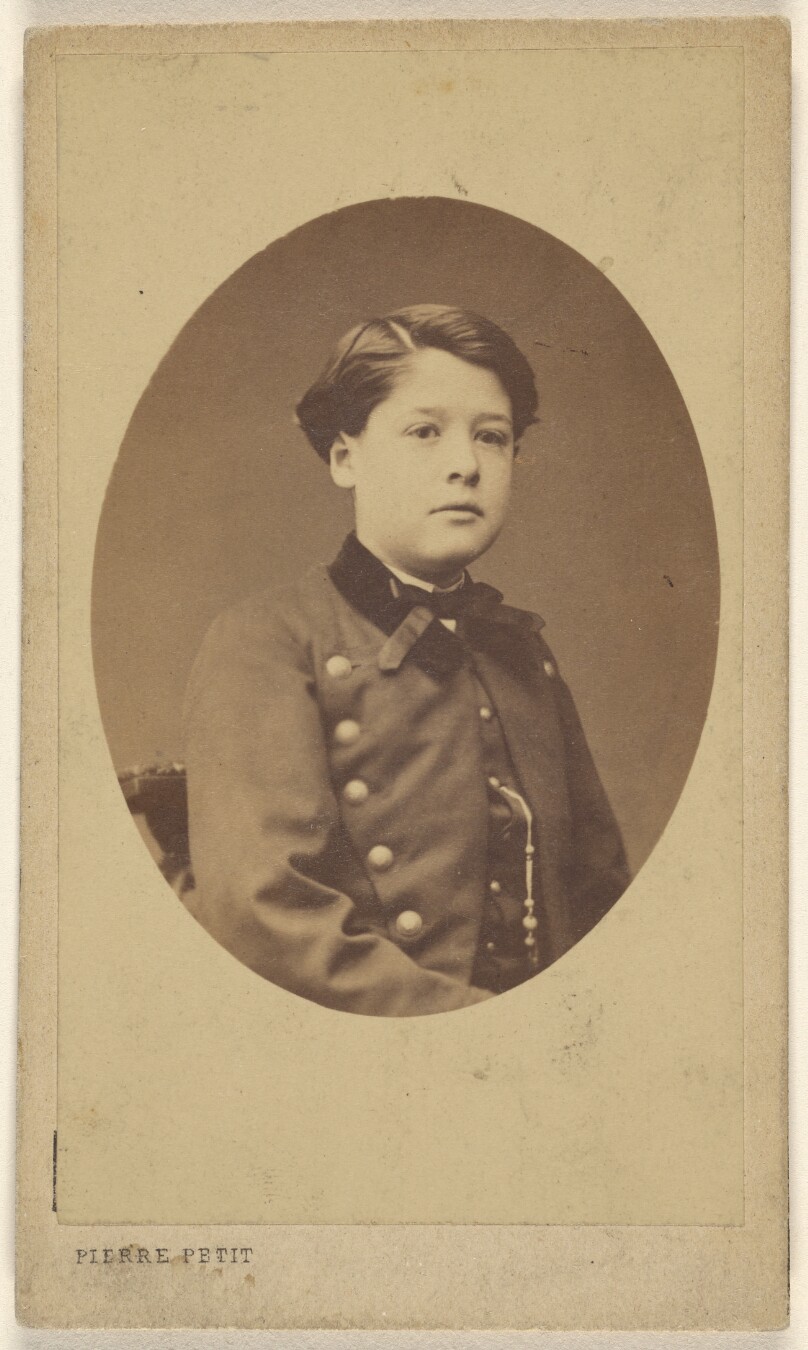 [Unidentified young boy seated, printed in quasi-oval style]