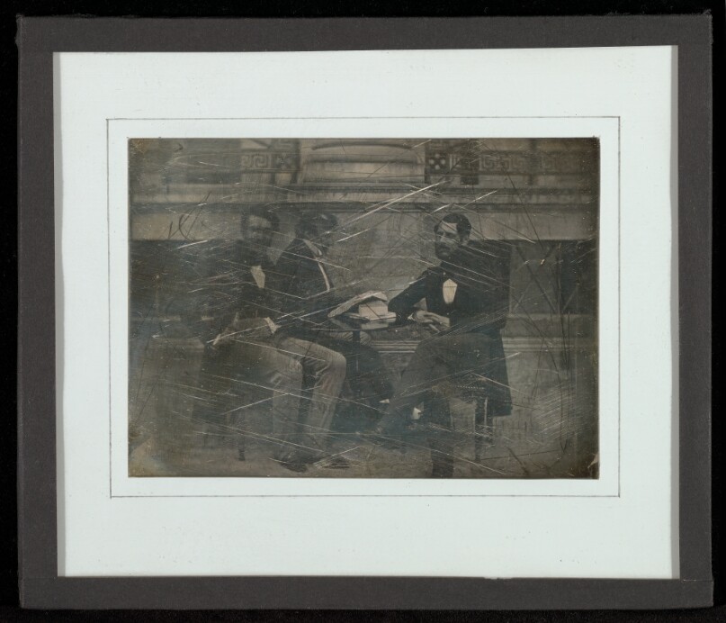 [Group portrait of three men]