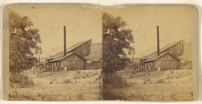 [Long view of a building with a smokestack, Arizona]