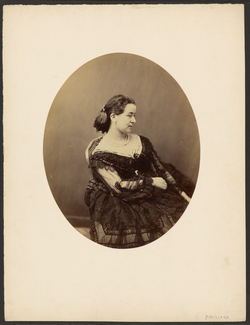 [Woman seated in profile]