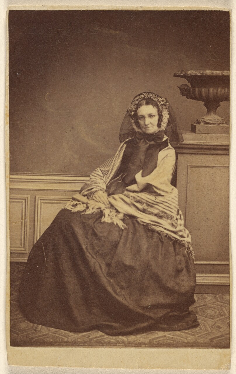 [Unidentified woman wearing a bonnet and shawl, seated]