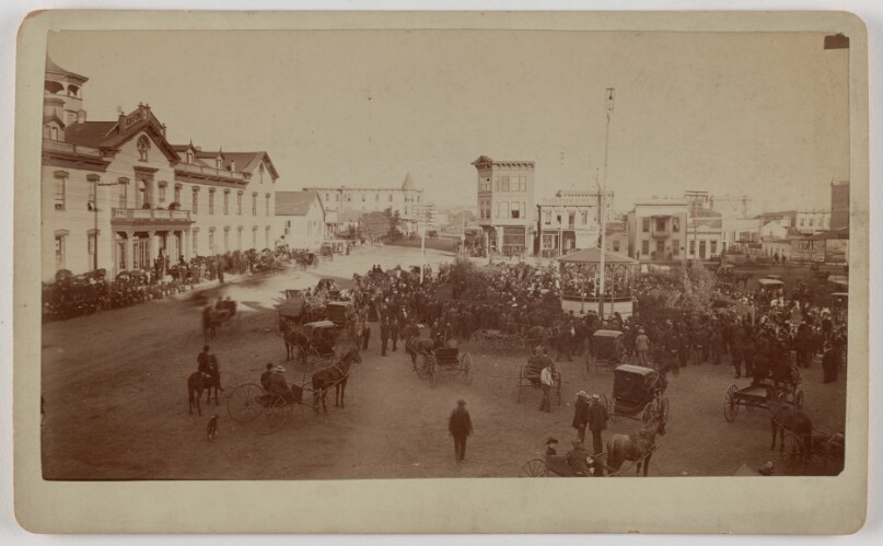 [View of San Diego town square with visible building signs "Horton House", "Kean" and "Plaza Stove Store"]