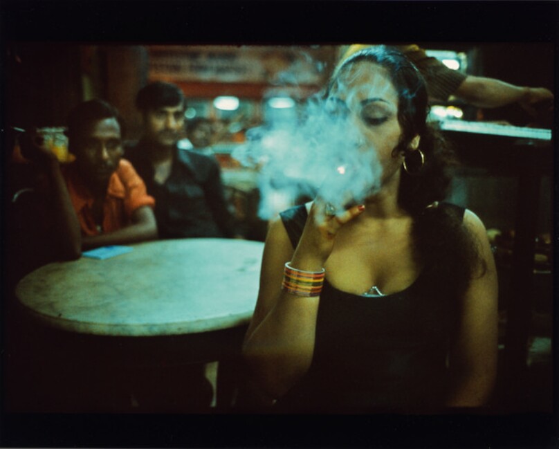 Transwoman smoking in the Olympia Cafe, Bombay, India