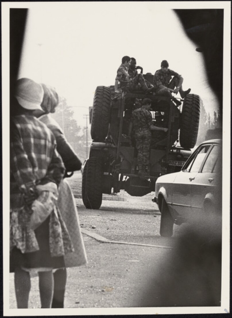 Untitled [Tank from behind, group of girls at left]