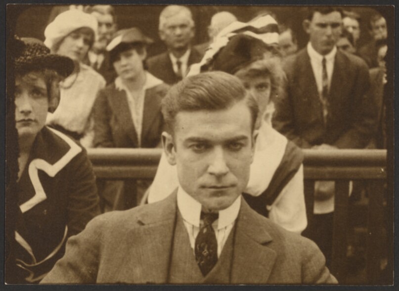 [Film still of man in courtroom drama]