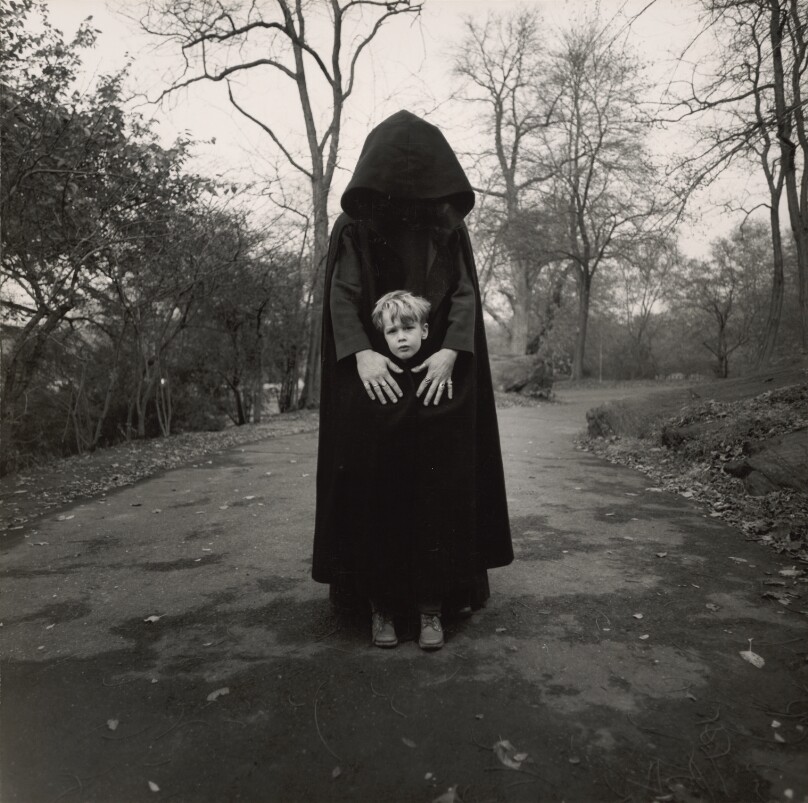 Young Boy and Hooded Figure, New York, New York