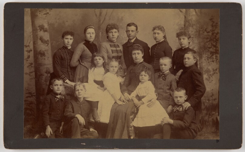 [Group family portrait of fifteen people]