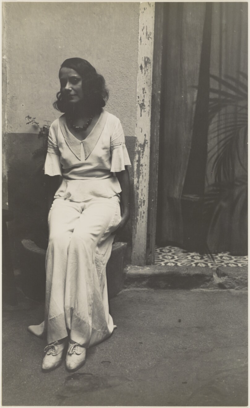 [Seated Well-Dressed Young Woman]