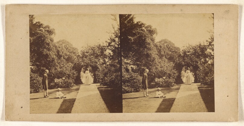 [Woman walking down a path, man and child to left]