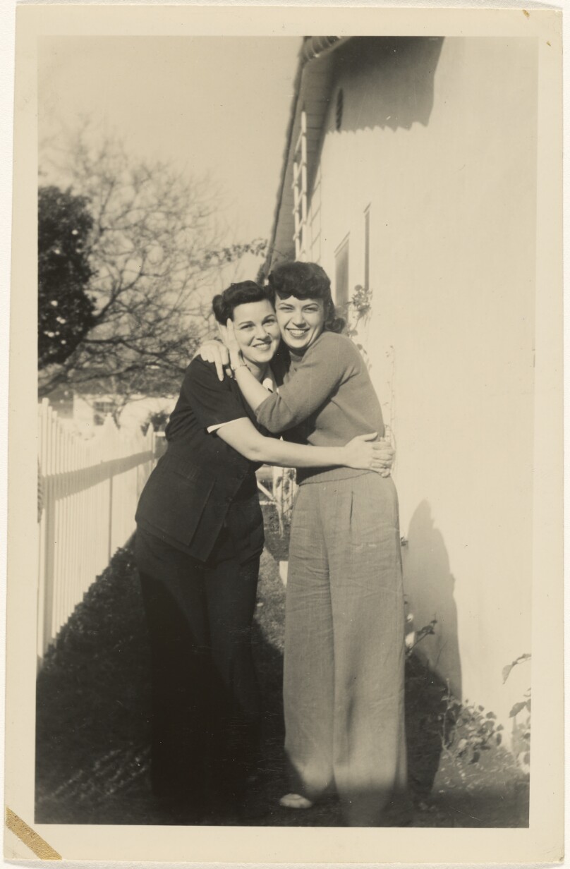 [Two women hugging]