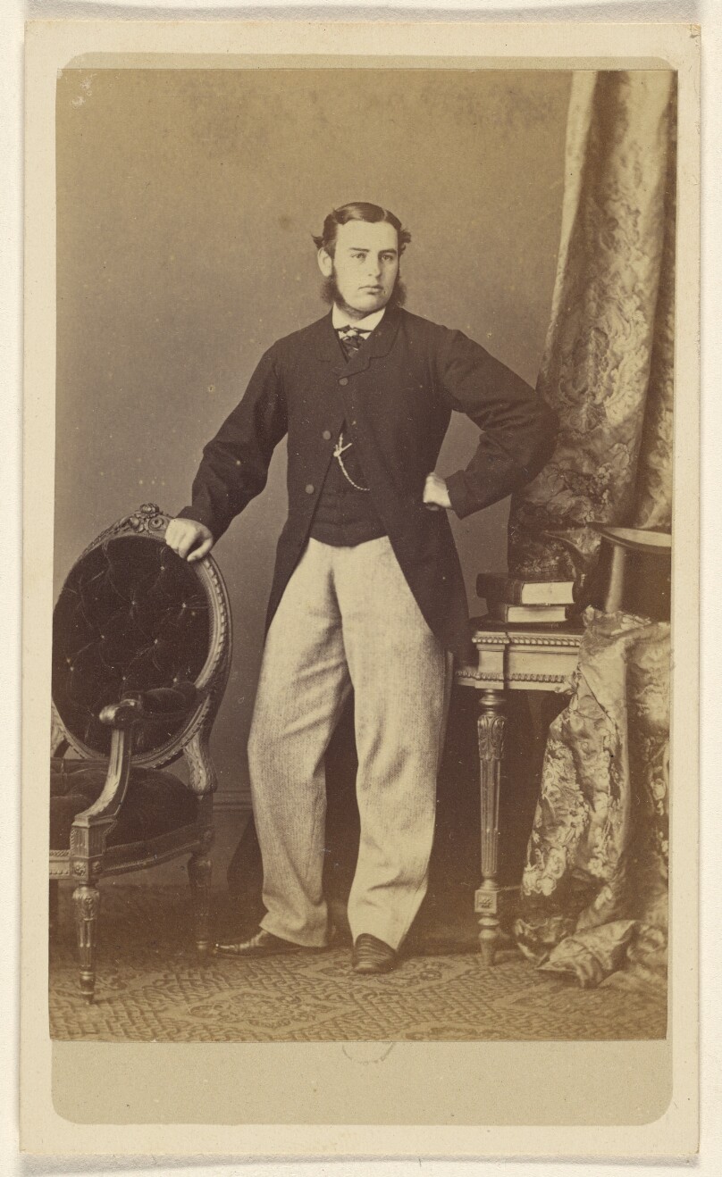 [Man with muttonchops, standing]
