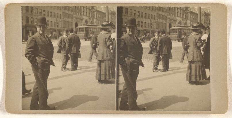 [Albany, N.Y. street scene, people walking, man in derby at left]