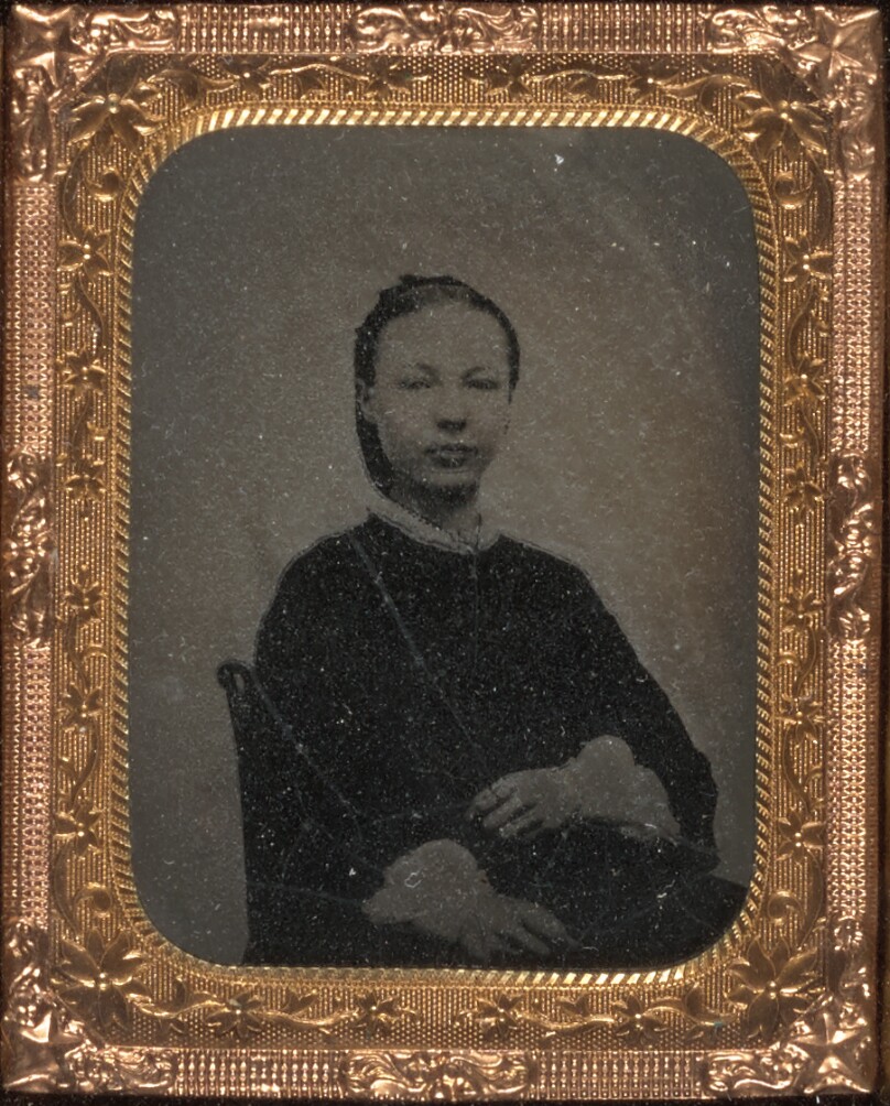 [Young woman seated]