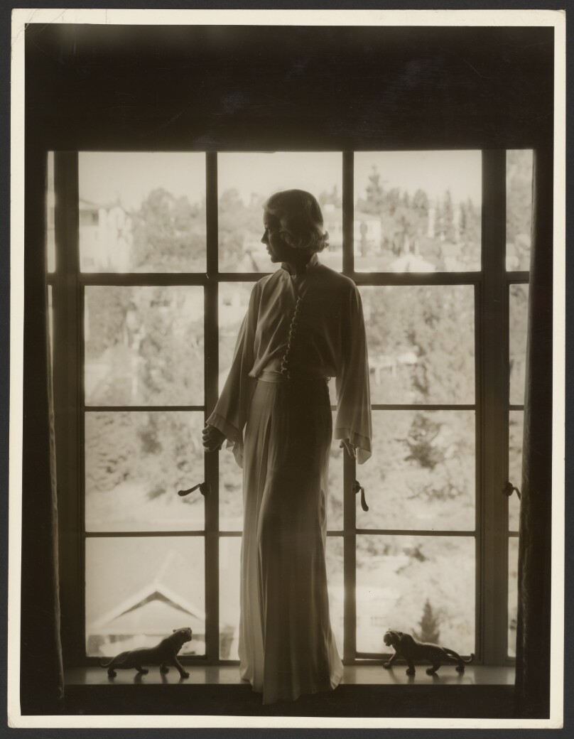[Woman in front of window]
