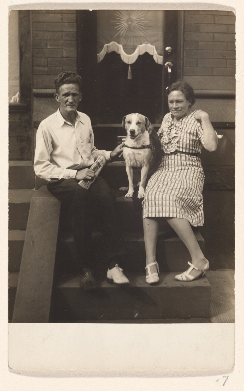 [Couple with a dog]