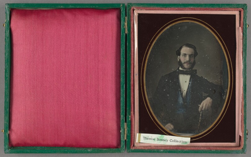 [Portrait of a well-dressed bearded man]