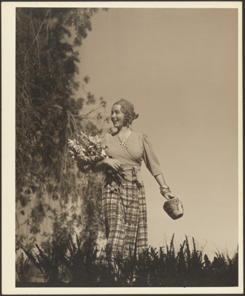 [Woman with bouquet of flowers]