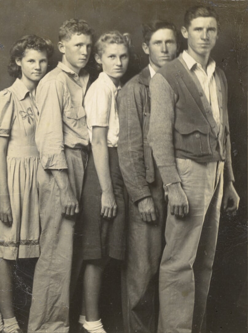 [Five siblings, standing]
