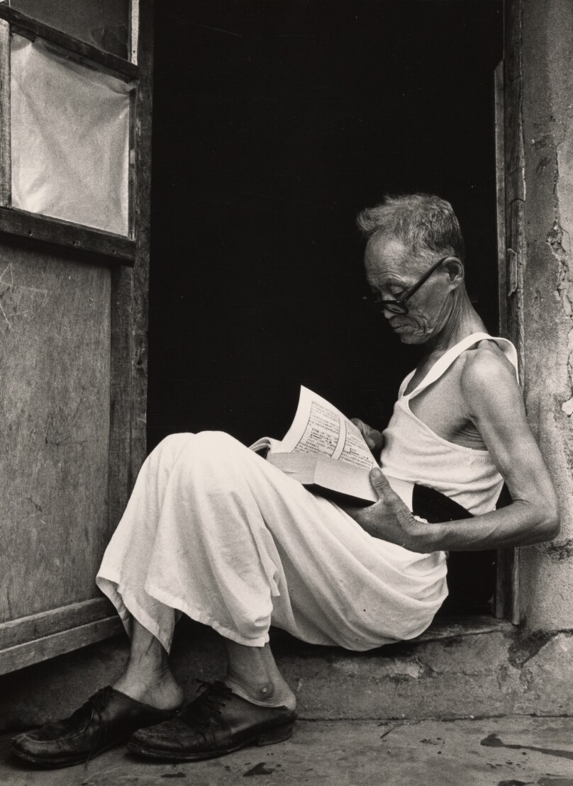 Elderly Man Reading Book