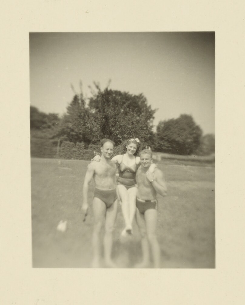 [Two men and one woman]