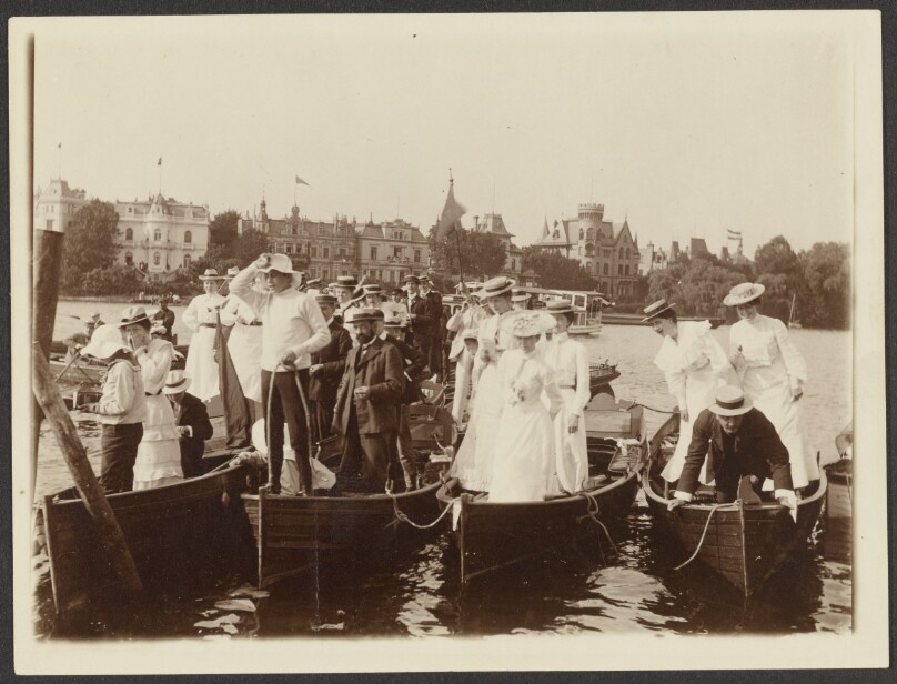 [Men and women in boats]