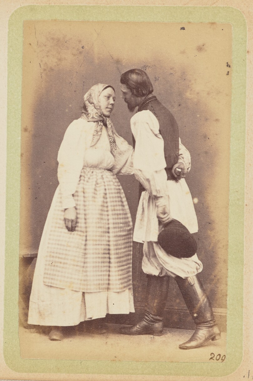 [Man and woman standing facing each other]