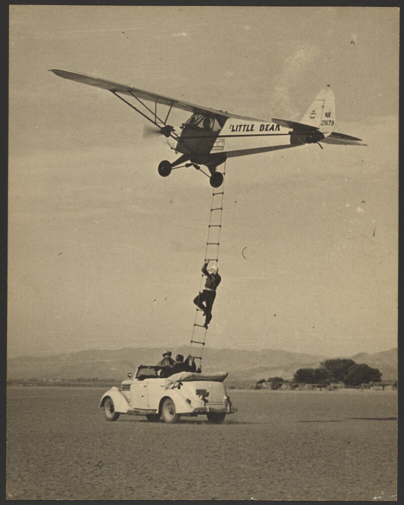 [Thomas Smith climbs ladder to Little Bear to continue endurance flight]