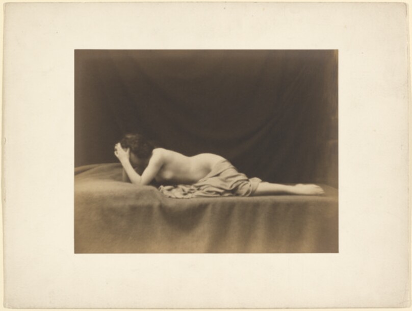 [Nude female with face in hands]