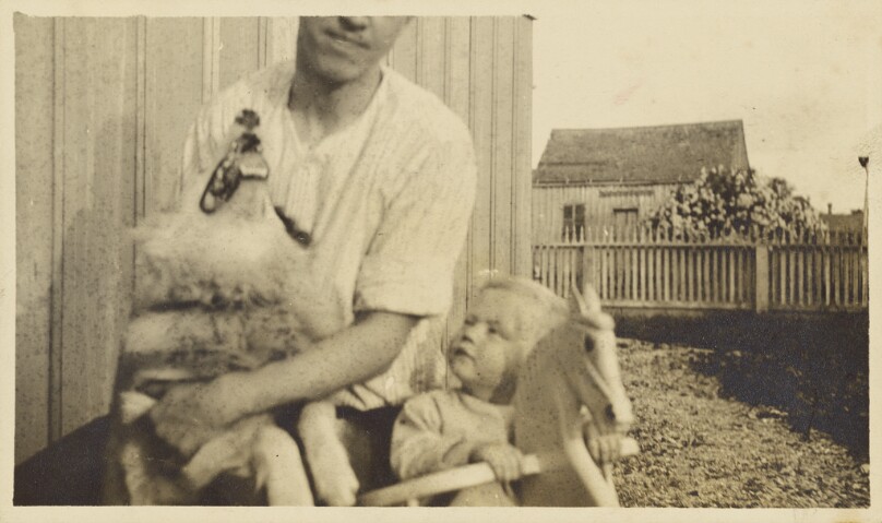 [Man with dog and child]