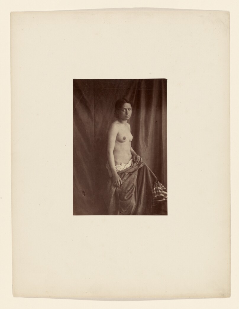[Draped nude female model]