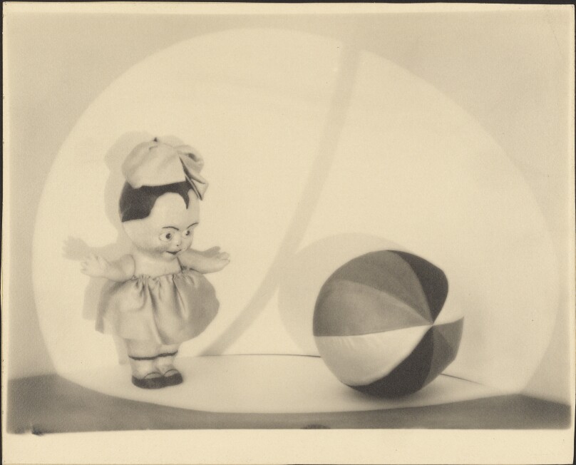 [Stock photo of doll and ball]