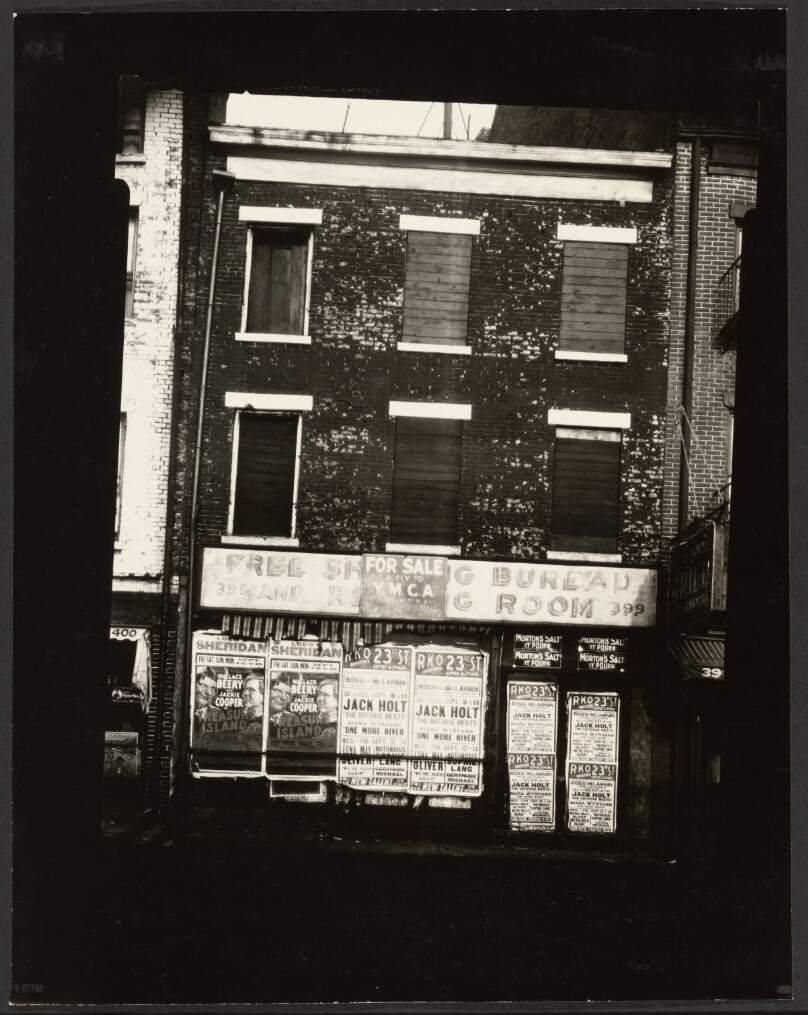[Abandoned Building with Movie Posters]