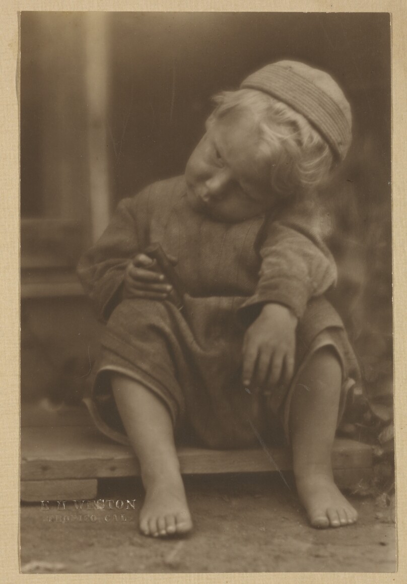 [Chandler Weston seated on step]