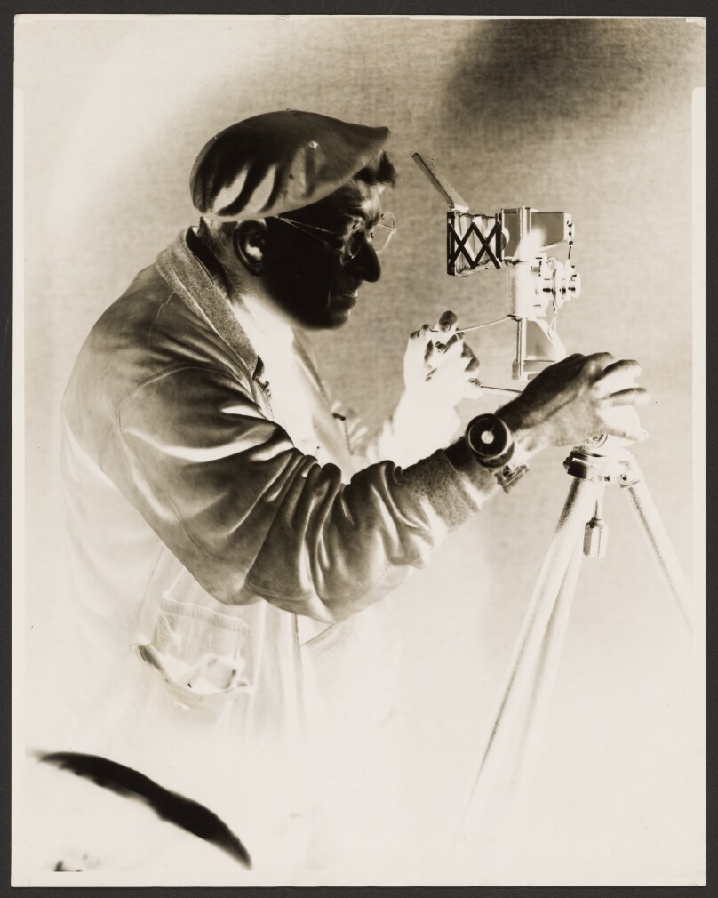 [Man at Camera]
