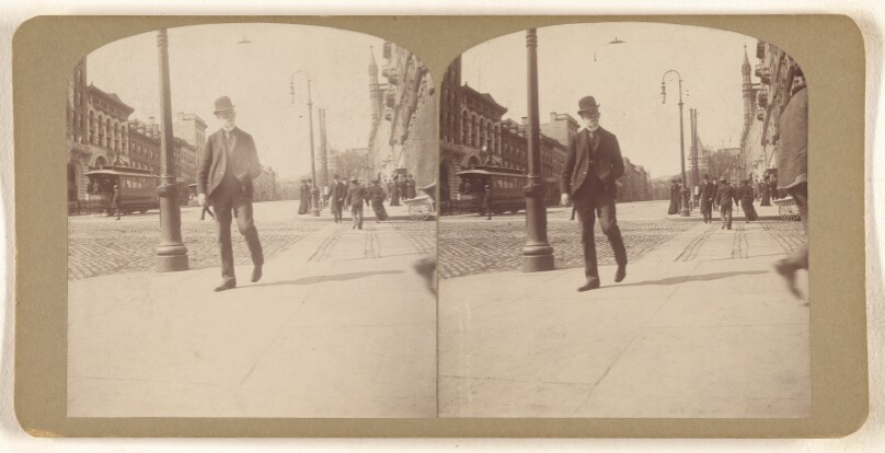 [Elder white-bearded man with derby walking on Albany, N.Y. street]